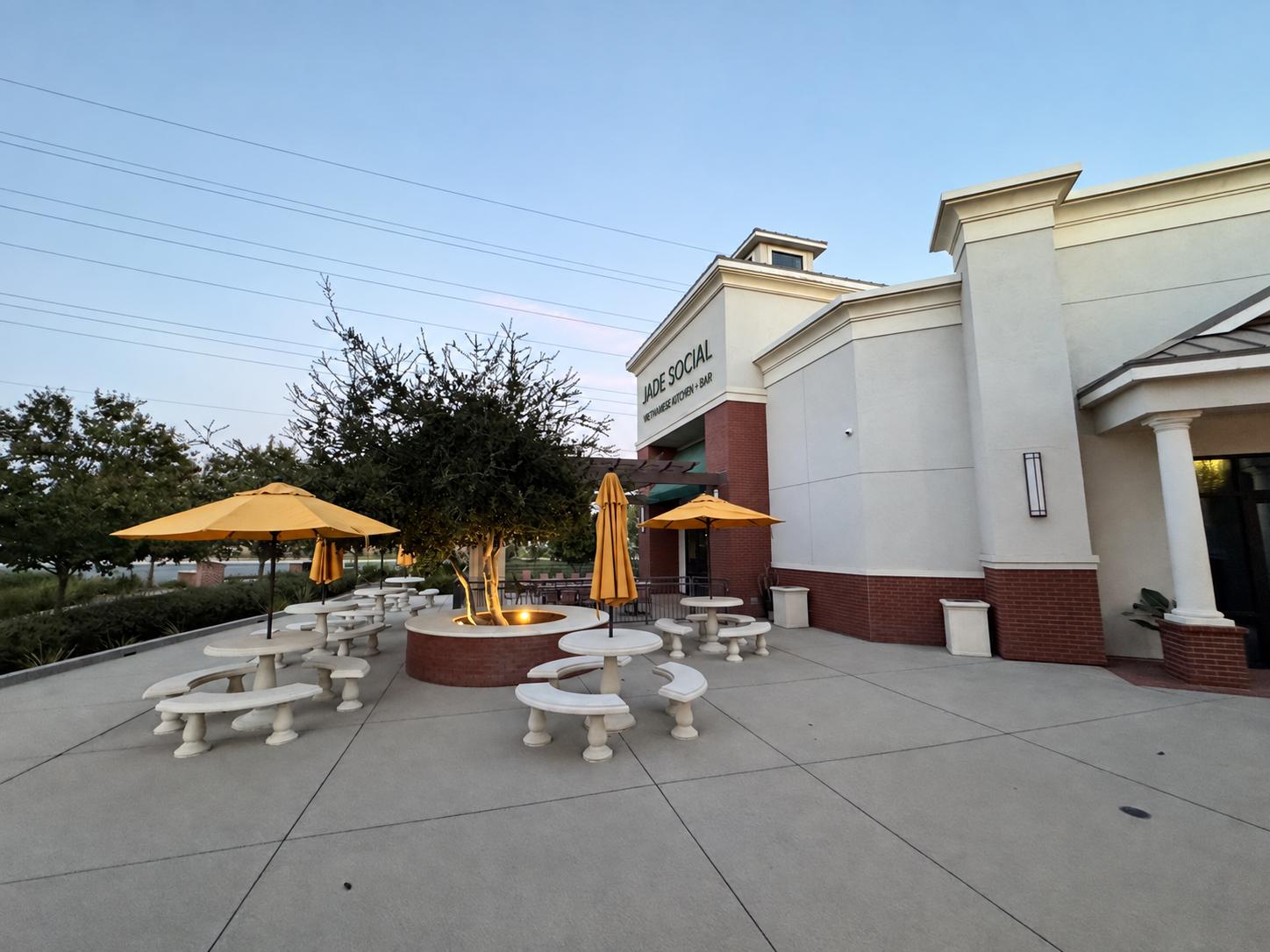 Actual restaurant exterior and patio with proposed Jade Social Vietnamese Kitchen and Bar signage